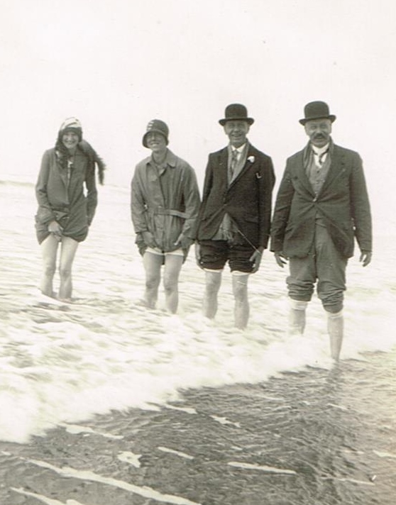four people paddling in the sea in 1924