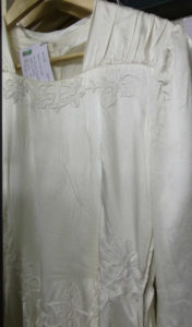 Embroidered flowers on off white faux silk wartime weddingdress 