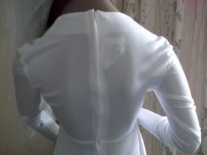 Top half of the back of the white crimplene wedding dress