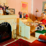 Sindy sits at home at her bureau to write a letter.